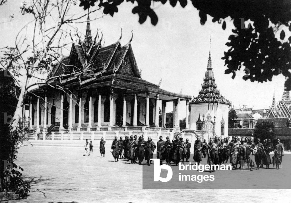 Cambodia: Buddhist monks of the Dhammayutikanikay order gather in front of the Silver Pagoda in Phnom Penh in 1924.