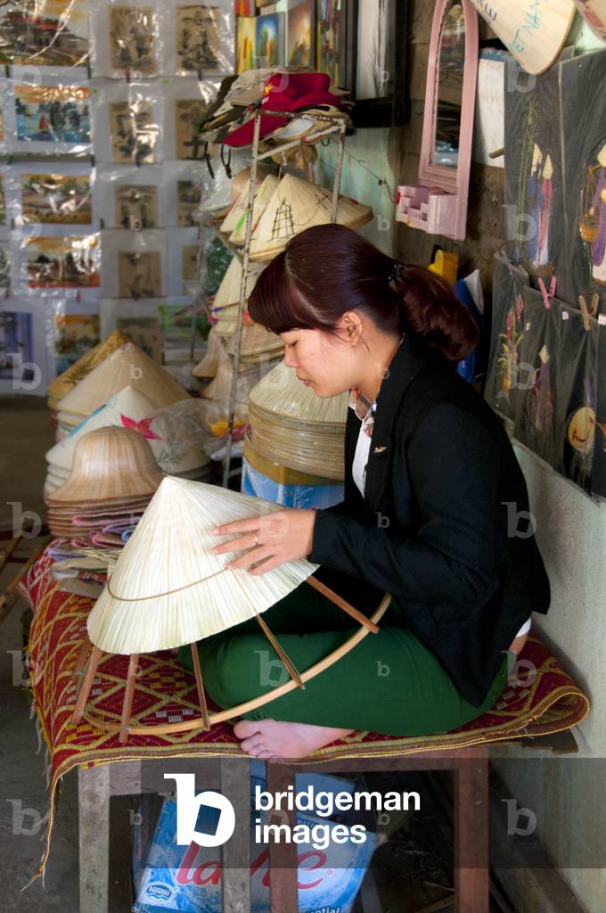 Vietnam: A non la (Vietnamese conical hat) maker, Hue