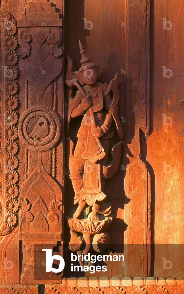 Burma / Myanmar: A statue detail at the all teak monastery of Shwe In Bin Kyaung, Mandalay (photo)