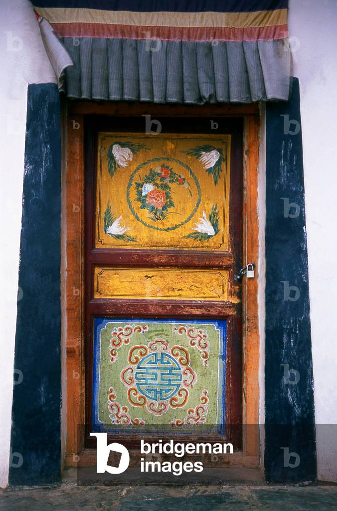 China: Elaborate doorway at Labrang Monastery, Xiahe, Gansu province