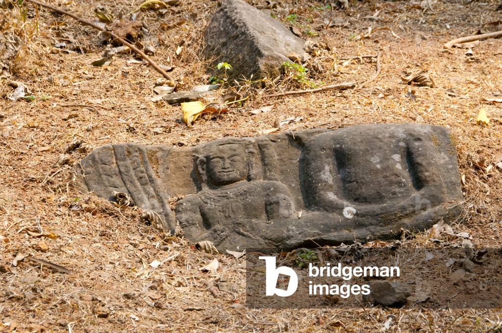 Cambodia: A stone Buddha bas-relief in the grounds of Preah Palilay, Angkor Thom, Angkor