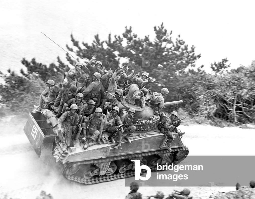 Japan / USA: Tank-borne US infantry moving up to take the town of Ghuta. Battle of Okinawa, May 1945, photo by Robert L Keller (b/w photo)