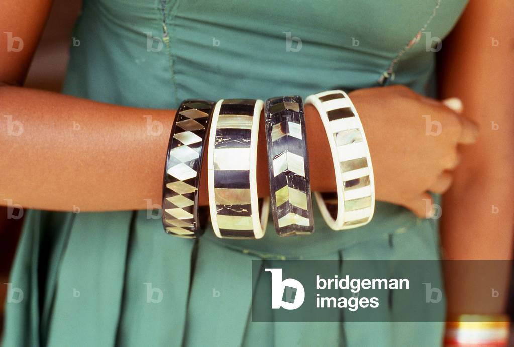 Maldives: Coral bracelets on a woman's arm, Addu Atoll (Seenu Atoll) 1980