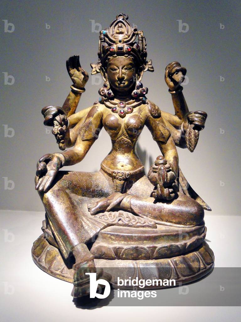 Nepal: Vasudhara, Goddess of Abundance, gilded copper inlaid with semiprecious stones, traces of vermilion, 1082 CE