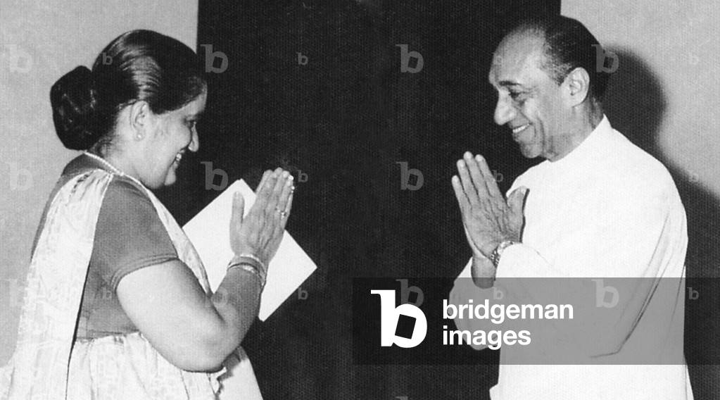 Sri Lanka: Former Premier Sirimavo Bandaranaike greeting President J. R. Jayewardene (1980).