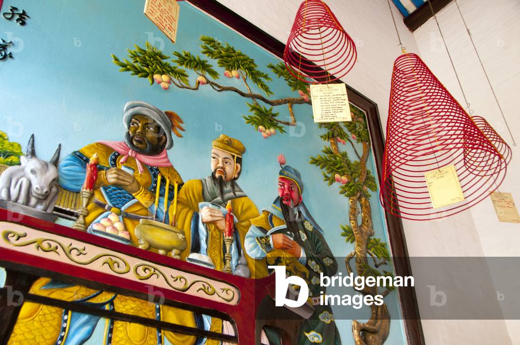 Vietnam: A painting depicting merchants behind coils of incense in the Assembly Hall of the Cantonese Chinese Congregation (Quang Trieu), Hoi An