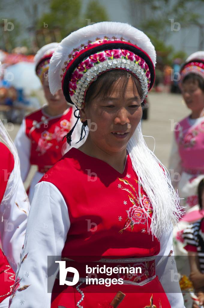 China: Bai woman dancing at the Bai music and dance festival at San Ta Si (Three Pagodas), Dali, Yunnan