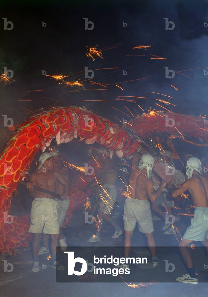 China: Miao men perform an elaborate dragon dance at a festival near Guiyang, Guizhou