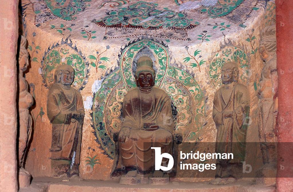 China: Buddha flanked by bodhisattvas, Buddhist stone relief carved into the rock face, Binglingsi, Yongjing County, Linxia Hui Autonomous Prefecture, Gansu