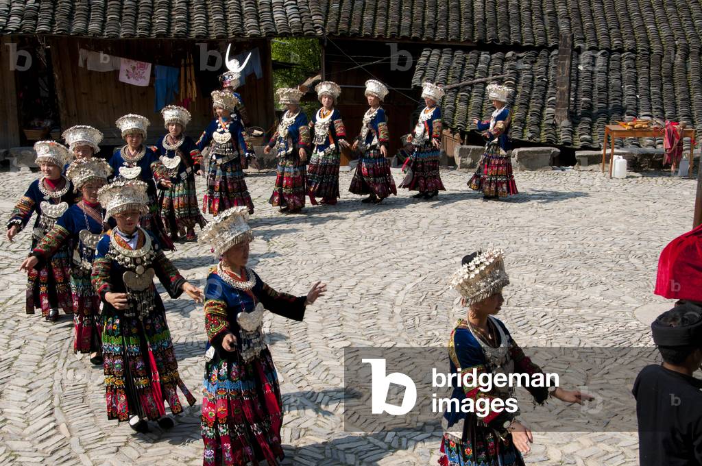 China: Miao women dancing in the village of Langde Shang, southeast of Kaili, Guizhou Province