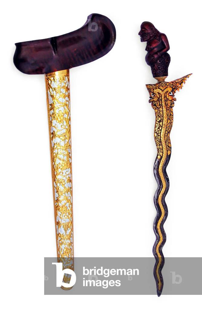 Indonesia: A gayaman-style kris, featuring Semar on the handle, floral etching on the sheath, and a dragon design on the blade. Probably from Solokarta, Java