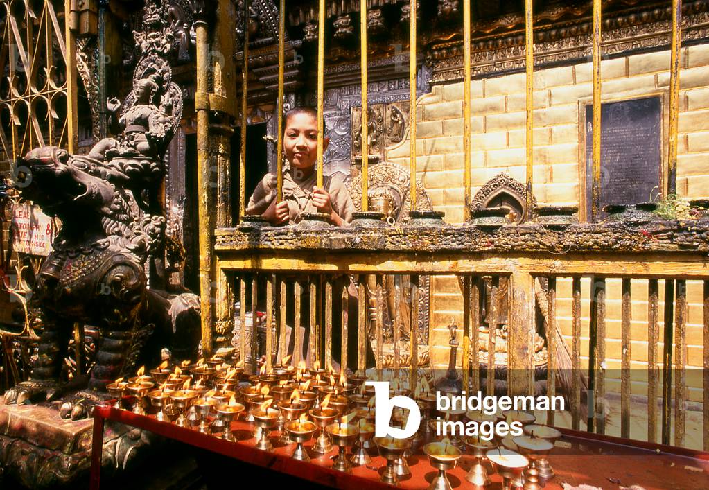 Nepal: A young boy and the Golden Temple (Hiranyavarna Mahavihara), Patan, Kathmandu Valley (1998)