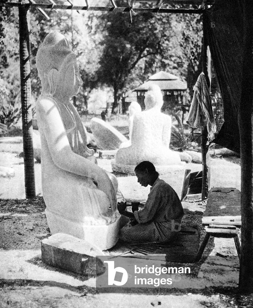 Burma/ Myanmar: A sculptor carves a Buddha statue from marble in Prome, lower Burma, c.1920s.