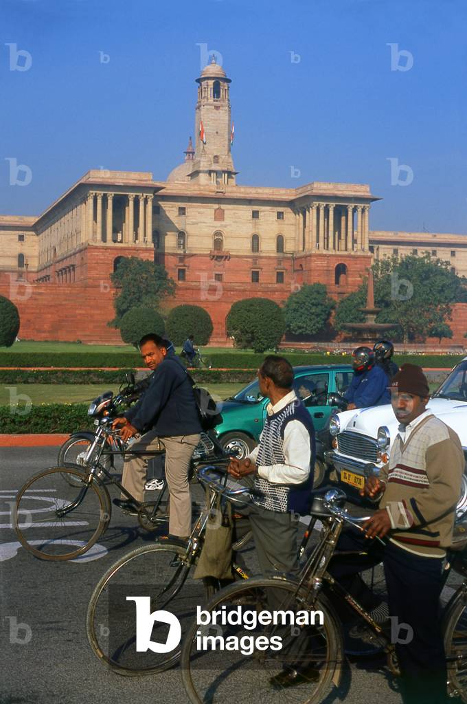 India: Early morning commuters in front of the Secretariat Building (Central Secretariat) home to India's government administration, Raisina Hill, New Delhi