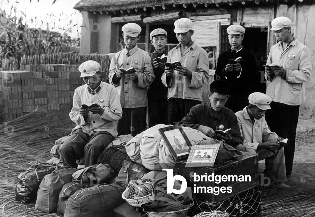 China: Reading Mao Zedong's 'Little Red Book' while waiting for transport, a scene from the Cultural Revolution (1966-1976), 1968