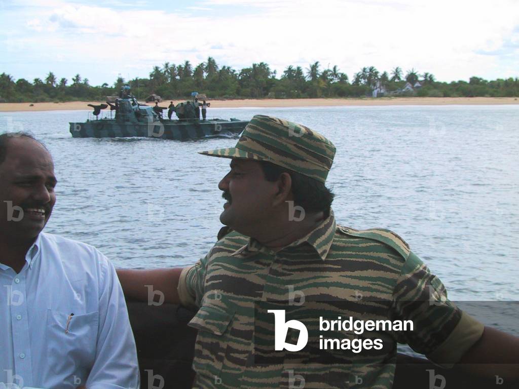 Sri Lanka: Colonel Soosai, head of the LTTE Sea Tigers, on a fast attack craft at Mullaitivu, 2003 (photo)
