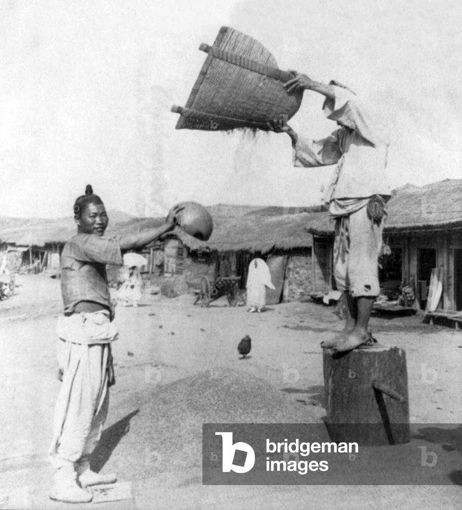 Korea: Winnowing barley in the streets of Chemulpo (Incheon, Inchon), early 20th century