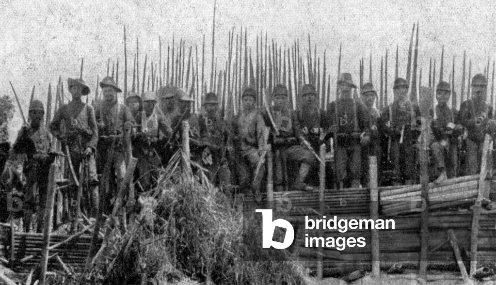 Indonesia / Netherlands: Victorious Dutch Marechaussee soldiers pose on top of the captured Acehnese fortress at Kutah Reh, 1904. Aceh War (1873 - 1914)