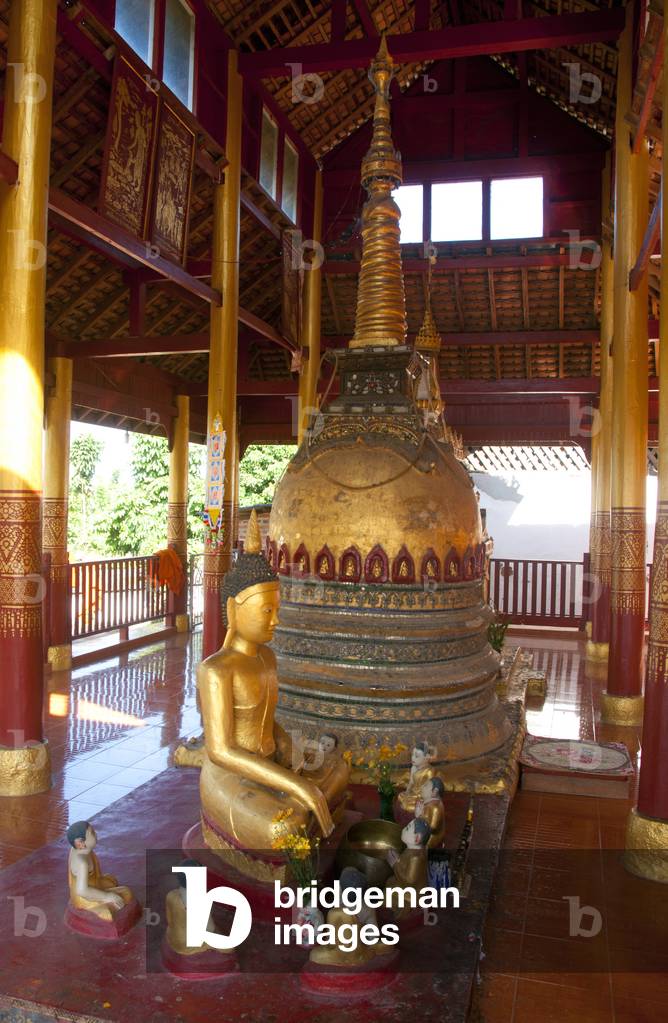Burma / Myanmar: A statue of the Buddha preaching to his disciples next to a small chedi in the Buddhist temple of Wat Jong Kham, Kyaing Tong (Kengtung), Shan State
