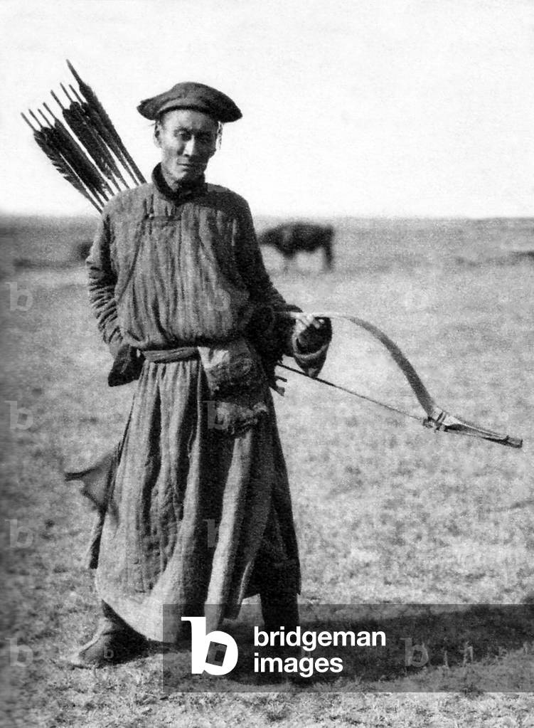 China / Inner Mongolia: A traditional Mongol archer in the Inner Mongolian grasslands, c. 1940. Front view