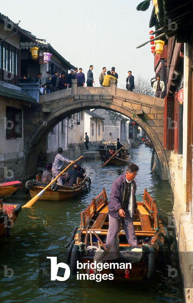 China: Boats and bridge on a canal in the 'Water Town' of Zhouzhuang, Jiangsu Province