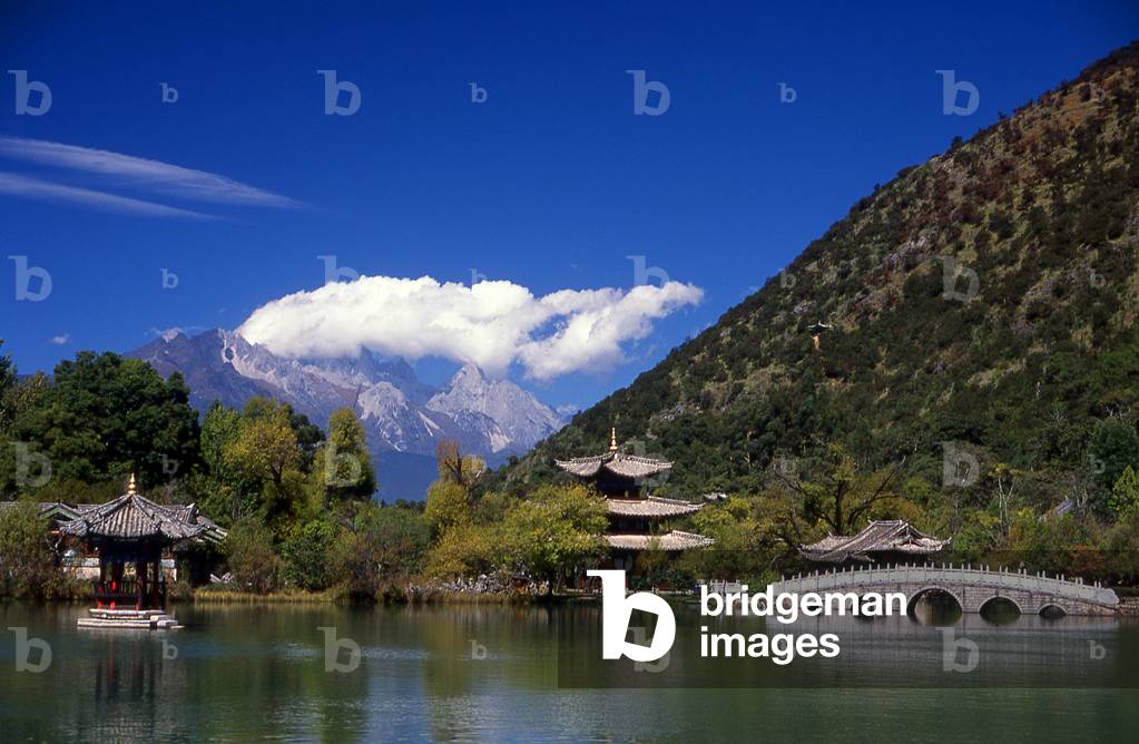 China: Jade Dragon Snow Mountain seen from Black Dragon Pool Park (Hēilóngtán), Lijiang, Yunnan Province