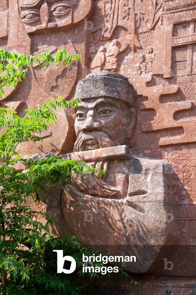 China: Naxi myths and legends portrayed on a wall at the edge of Lijiang Old Town, Yunnan Province
