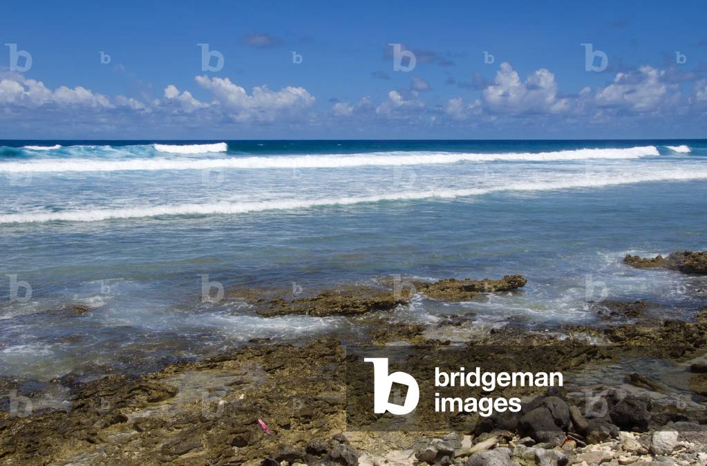 Maldives: Waves break on the coral reef which is very close to the island at this point, Hithadhoo Island, Addu Atoll (Seenu Atoll)