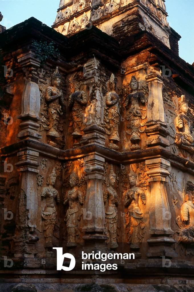 Thailand: Stucco thewada (angels) adorn the Maha Chedi (Great Chedi), Wat Chet Yot (Seven Spires), Chiang Mai, northern Thailand