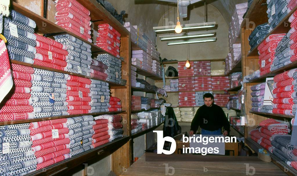 Syria: Keffiyeh (traditional Middle Eastern headdress) for sale in the ancient Great Bazaar (<i>suq</i>), Aleppo (1997)