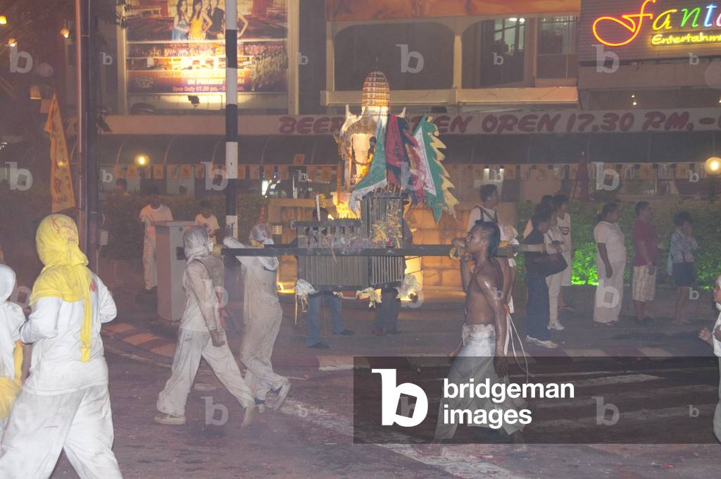 Thailand: Shrine bearers race through the streets in the night parade, Phuket Vegetarian Festival