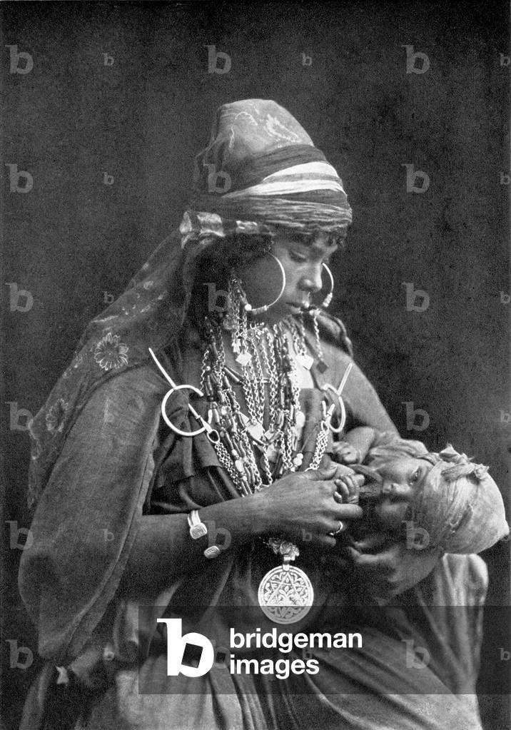 Arabia; A Bedouin mother and child, c. 1920
