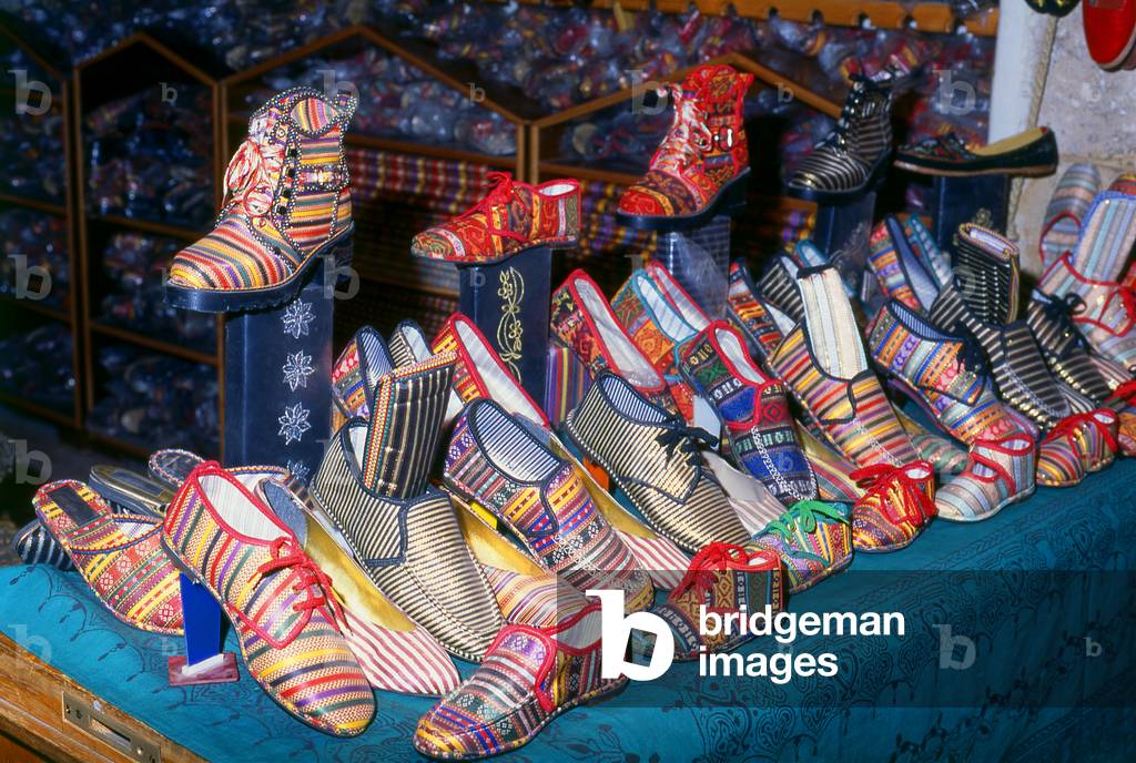 Syria: A shoe shop in the restored handicraft suq within Aleppo's Great Bazaar