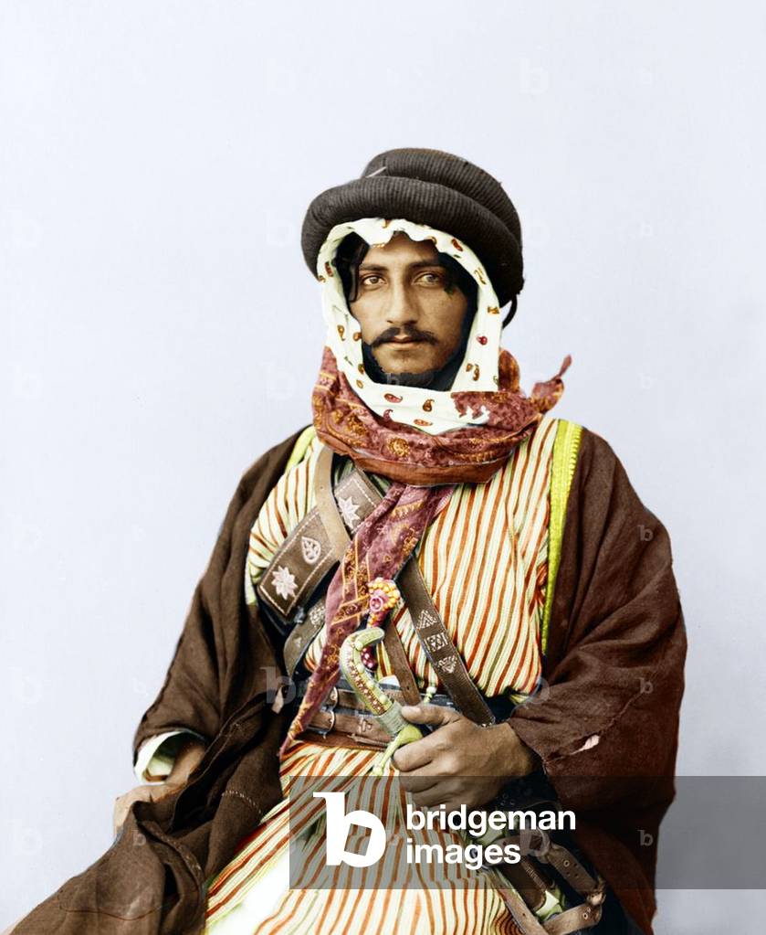 Palestine: A Palestinian Bedouin of means and position, hand-coloured print, c. 1909