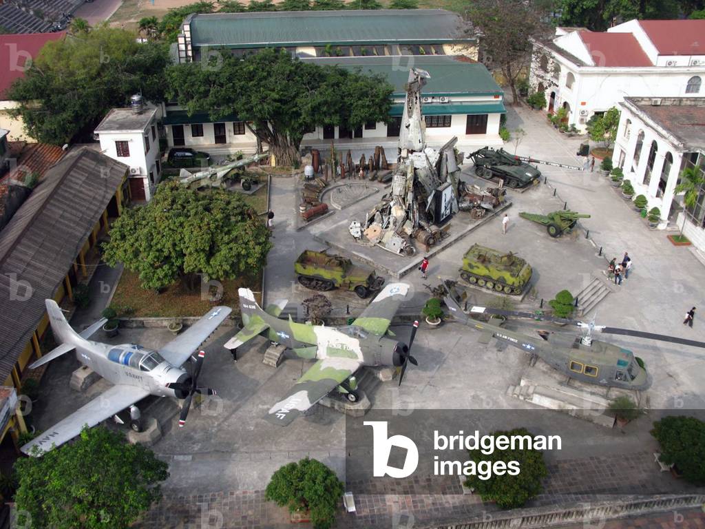 Vietnam: The rear court of the Army Museum, Hanoi, seen from above, centred on a pyramid of wreckage of shot down planes including parts of a USAF B-52, an F-111 and a French transport plane