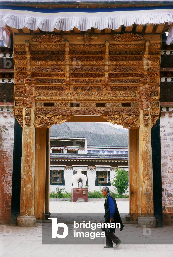 China: A Tibetan pilgrim at Labrang Monastery, Xiahe, Gansu province