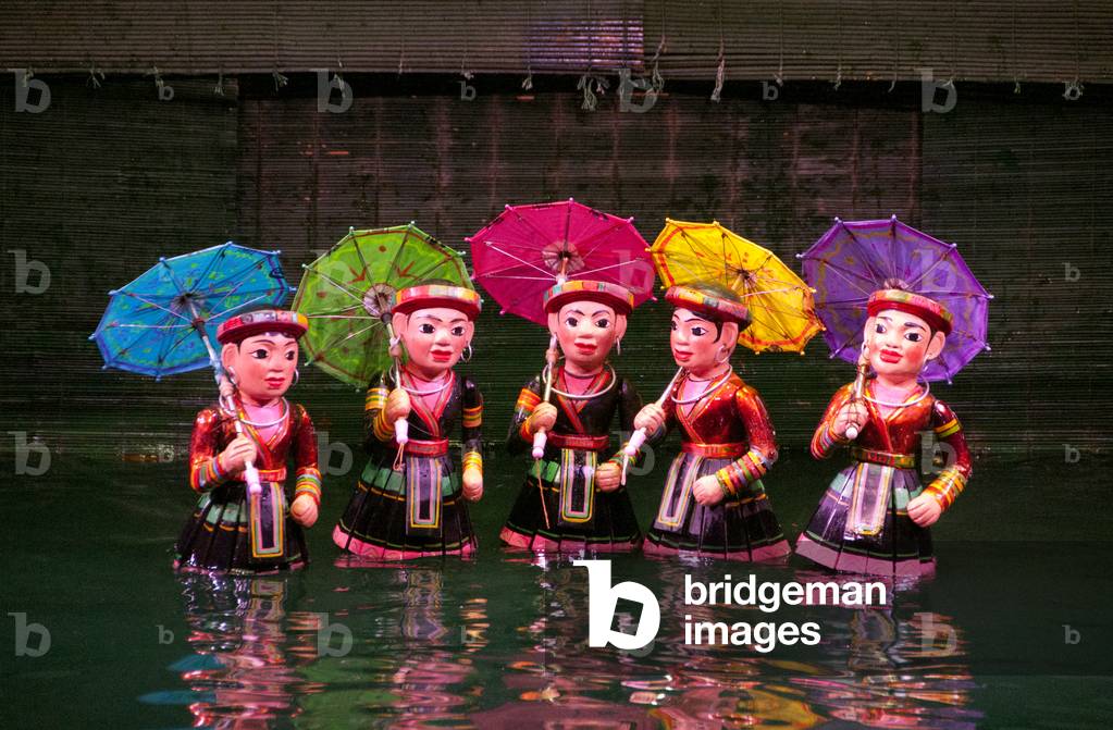 Vietnam: Dancers representing some of Vietnam's minorities; puppets dancing on the water at the Thang Long Water Puppet Theatre, Hanoi