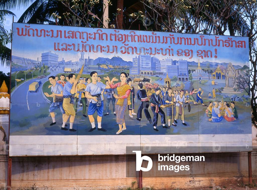 Laos: Revolutionary Socialist realist-style political poster on the streets of Vientiane