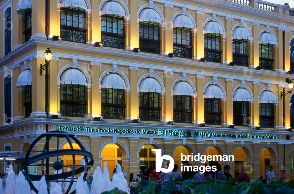 China: The Macau Business Tourism Centre in an old Portuguese colonial building in Largo do Senado Square (Senate Square) at dusk, Macau