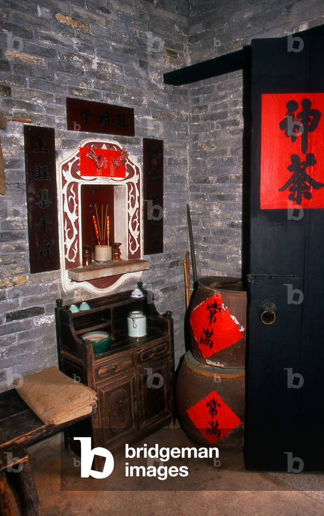 China: Family shrine in the corner of a traditional Chinese room in the recreated village within the Dr. Sun Yatsen Residence Museum, Cuiheng, Guangdong Province