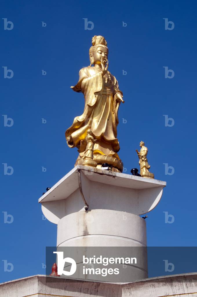 Thailand: The Goddess Kuan Yin overlooks the town above Wat Matchimaphum, Trang Town, Trang Province, southern Thailand