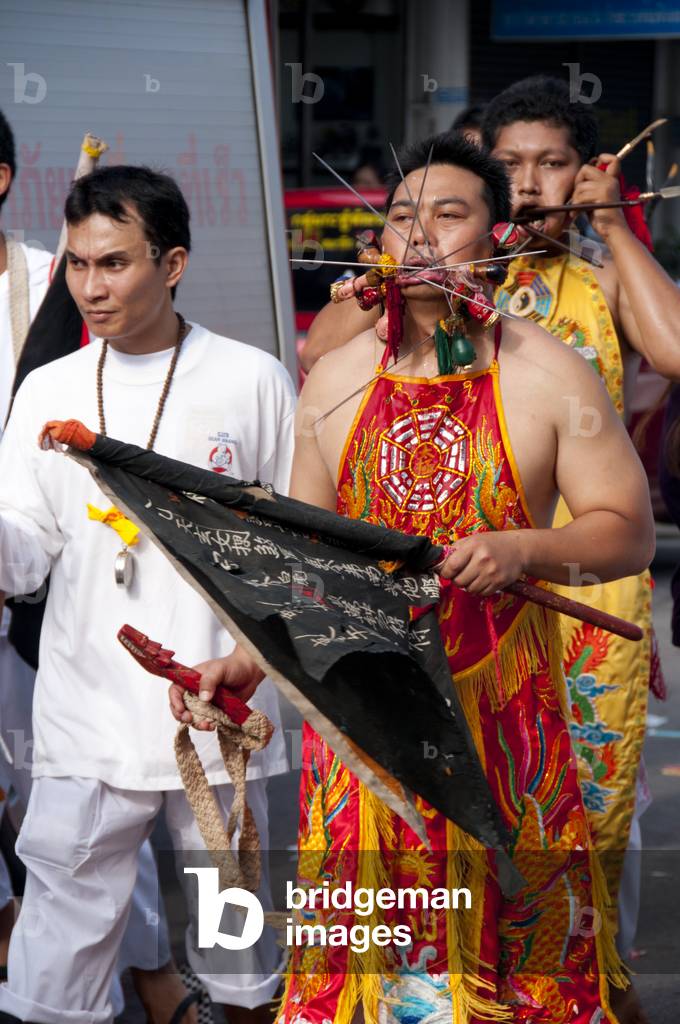 Thailand: Entranced devotee or 'Ma Song' takes part in a procession through Phuket Town, Phuket Vegetarian Festival