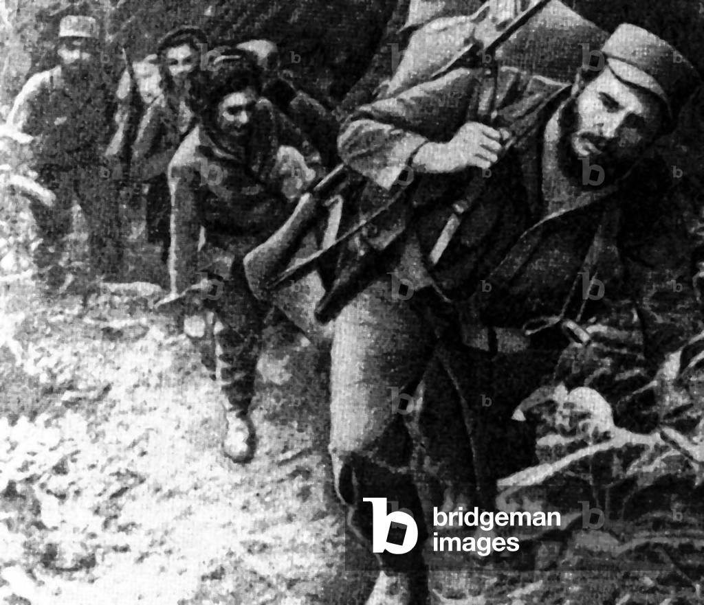 Cuba: Fidel Castro with a group of guerrillas in the Sierra Madre, c. 1958. The female guerrilla following him is probably Celia Sánchez Manduley (May 9, 1920 - January 11, 1982), a participant of the Cuban Revolution and a close friend and rumored lov