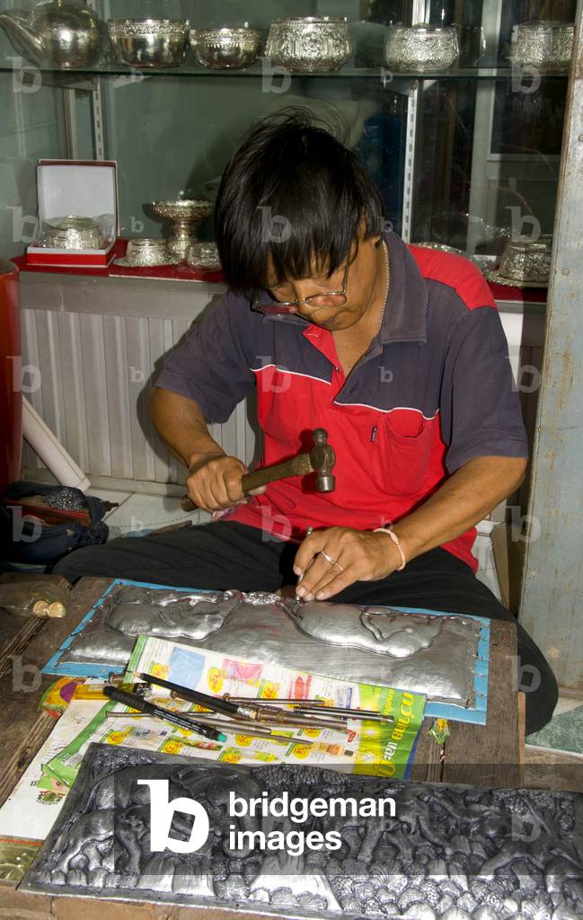 Thailand: Silversmith working on an elephant panel, Wualai Road, Chiang Mai, north Thailand