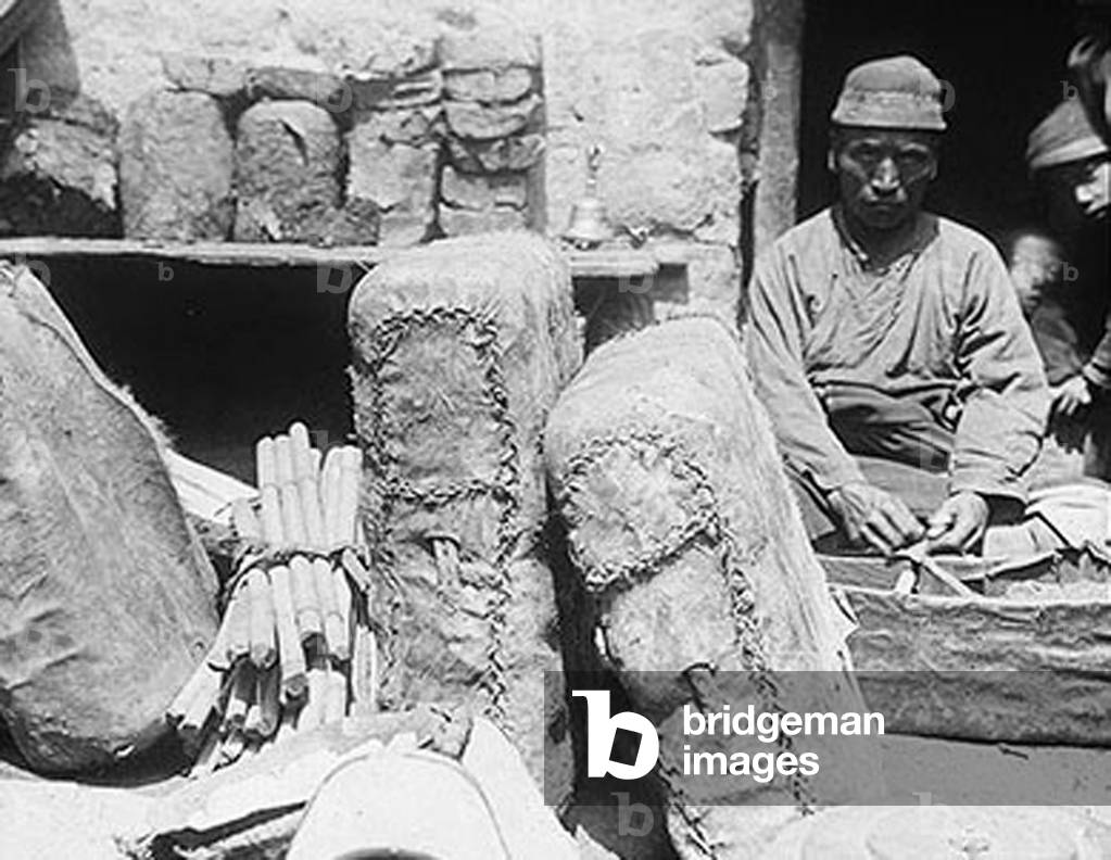 China: Tea shop with bags of brick tea, Lhasa, c.1928.