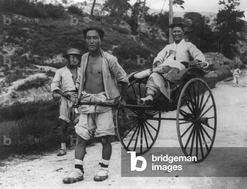 Korea: Mandarin being pulled in a rickshaw, early 20th century