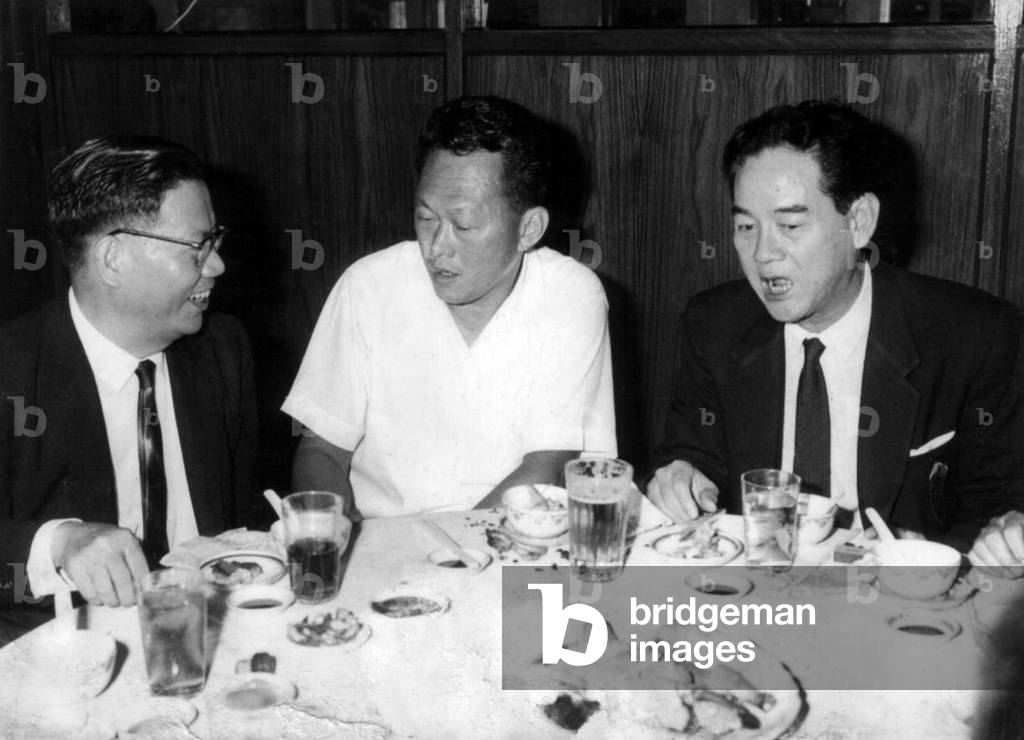 Singapore: Lee Kuan Yew (centre), Prime Minister of Singapore, having dinner with Dr Ngeow Sze Chan (left) and an unidentified third man, c. 1960s