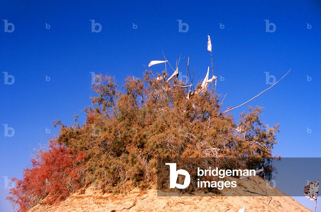 China: A tomb in the sand dunes near the Imam Asim Mazar (shrine) in the desert near Khotan, Xinjiang Province