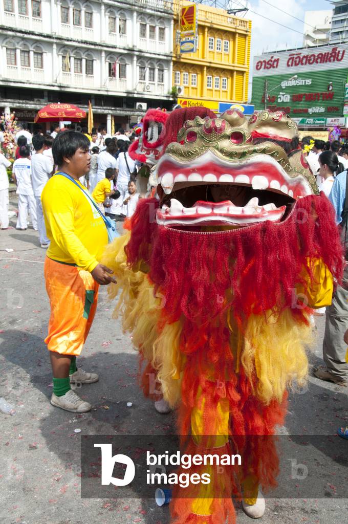 Thailand: Chinese lion dancers in the procession through the streets of Phuket Town, Phuket Vegetarian Festival