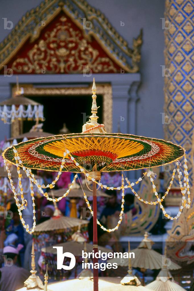 Thailand: Parasols held above the heads of the 'Crystal Sons' at Wat Phra Singh, Poy Sang Long Festival, Chiang Mai